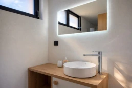 Luxury bathroom vanity with backlit mirror in Astria Villas rental