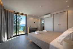 Luxury bedroom with bay view at Astria Villas rental