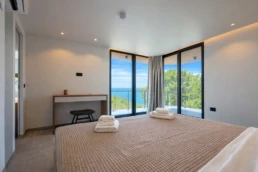 Luxury bedroom with panoramic sea view at Astria Villas rental