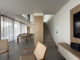 Villa 2 in Vourvourou, Halkidiki, featuring a kitchen and dining area connected to a bright living space.