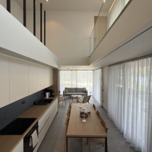 Villa 3 in Vourvourou, Halkidiki, with elegant design, private terrace, pool, and views of sea and olive trees.