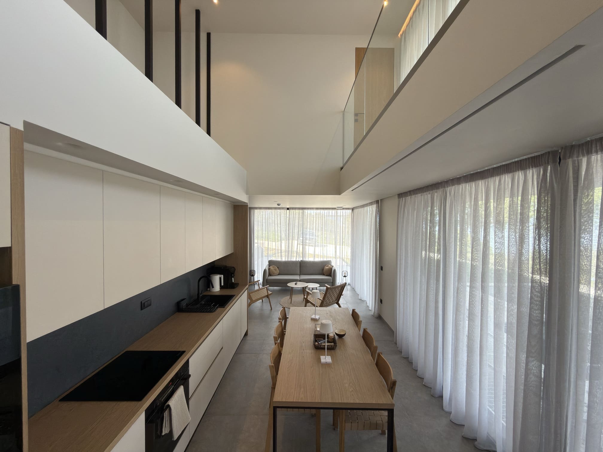 Villa 3 in Vourvourou, Halkidiki, with elegant design, private terrace, pool, and views of sea and olive trees.